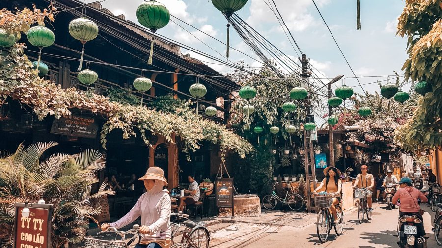 Red lanterns strung from yellow buildings in Hoi An Old Town, Vietnam