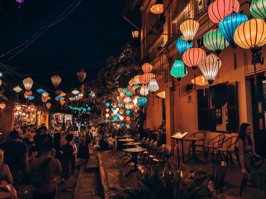 Colourful lanterns hanging from a building at night in Hoi An, Vietnam