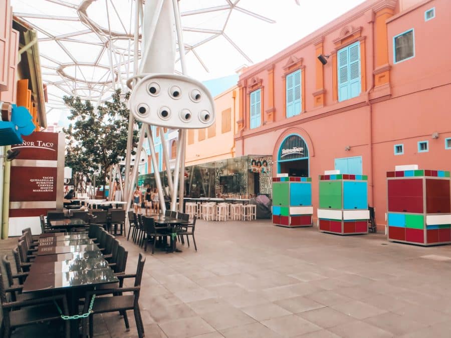 Multi-coloured buildings on a pedestrianised street in Clarke Quay, where to stay in Singapore