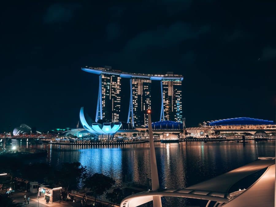 Marina Bay Sands at night across the water with the ArtScience Museum next to it, Singapore