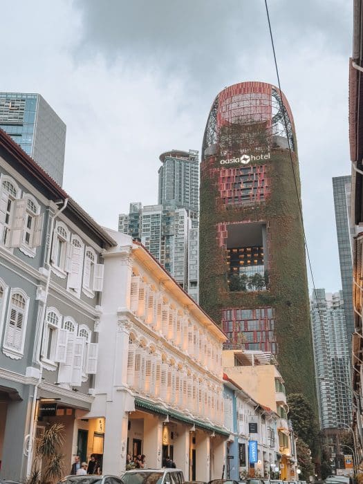 Oasia Hotel Downtown towering above traditional shophouses in Chinatown, where to stay in Singapore