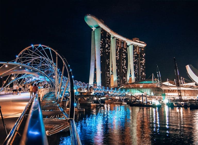 The imposing Marina Bay Sands towering above the water at night in Singapore