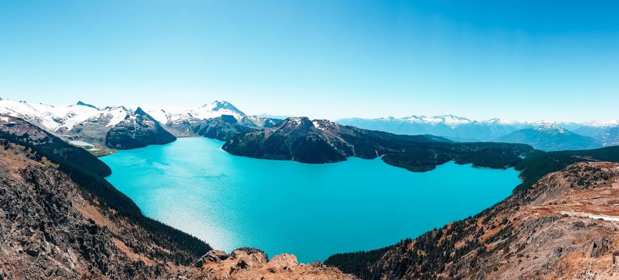 Panoramic view over Panorama Ridge with the striking glacial Garibaldi Lake below and snow-capped mountains in the distance, Whistler in summer, British Columbia, Canada