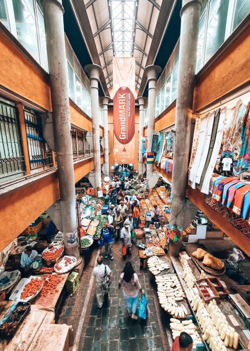 Colourful stalls of fruit, vegetables and fabrics at the Central Market in Port Louis, Mauritius