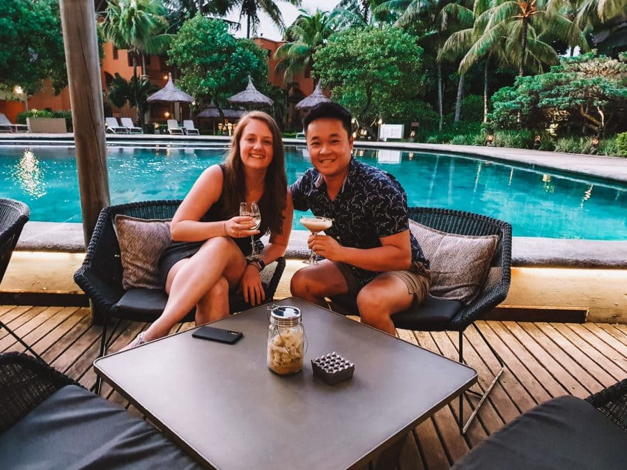 Helen and Andy having cocktails by the swimming pool at the Heritage Awali in Mauritius, Indian Ocean