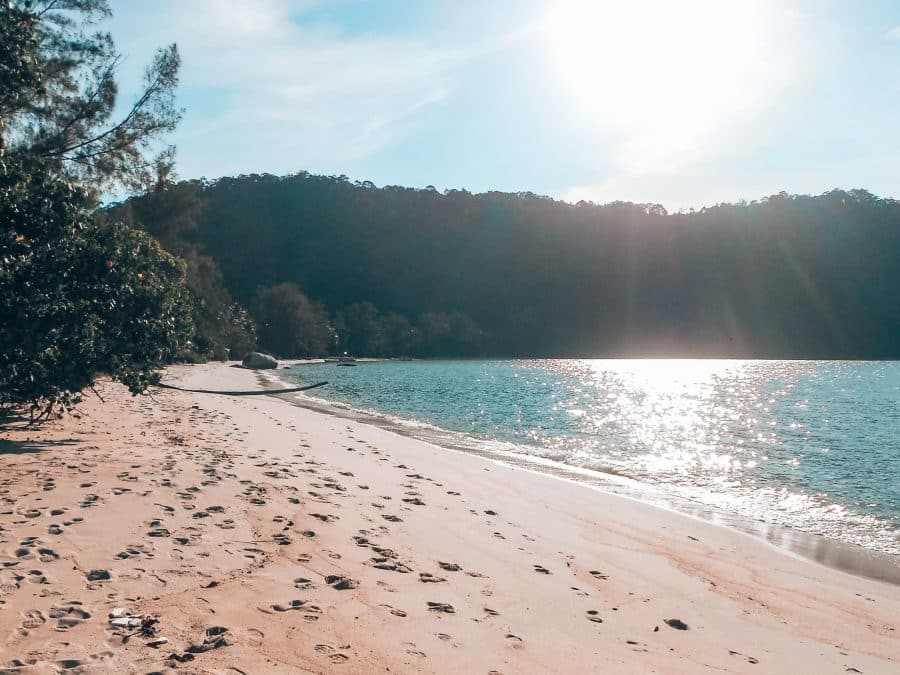 A secluded long stretch of beautiful white sand beach in Penang National Park, is one of the most peaceful places to visit in Malaysia