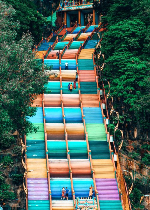 Tall colourful stairs surrounded by lush thick greenery, Kuala Lumpur, Malaysia