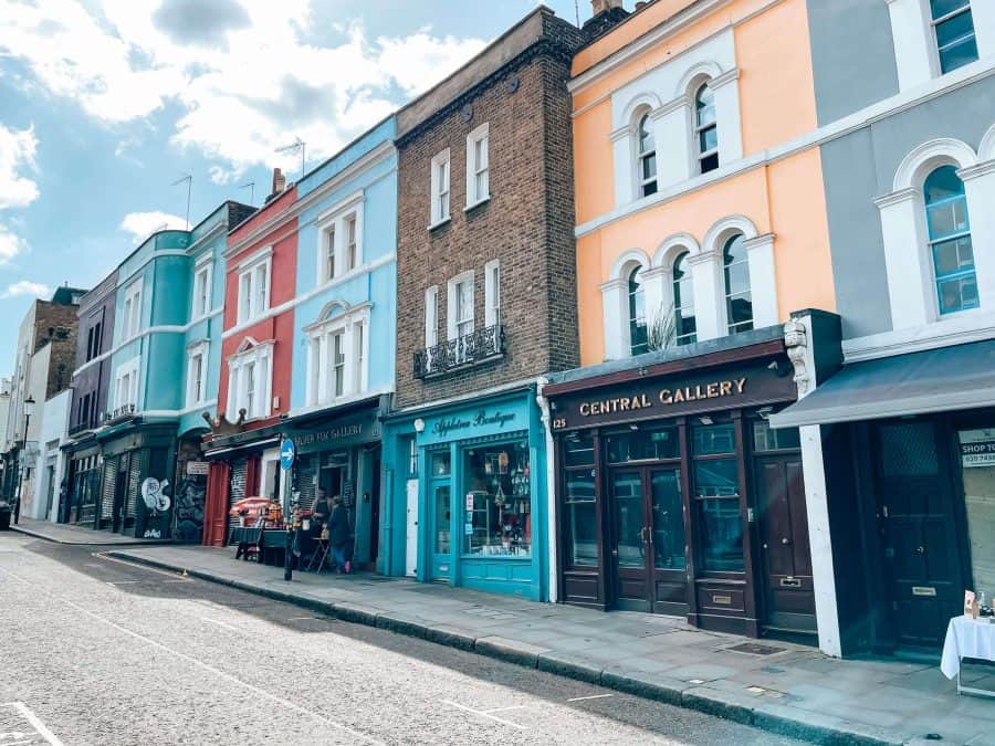 Admiring the colourful buildings and shop fronts on Portobello Road is one of the best free things to do in London, Notting Hill, UK, England