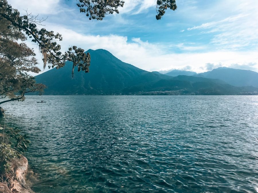 View from Cerro Tzankujil Nature Reserve across Lake Atitlan to the surrounding volcanoes, Guatemala