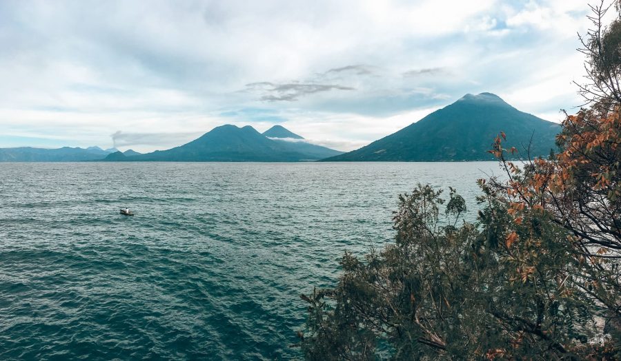 View from Cerro Tzankujil Nature Reserve across Lake Atitlan to the surrounding volcanoes, Guatemala