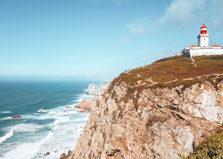 Cabo da Roca's quaint lighthouse overlooking the rough ocean, Sintra, Lisbon, Portugal