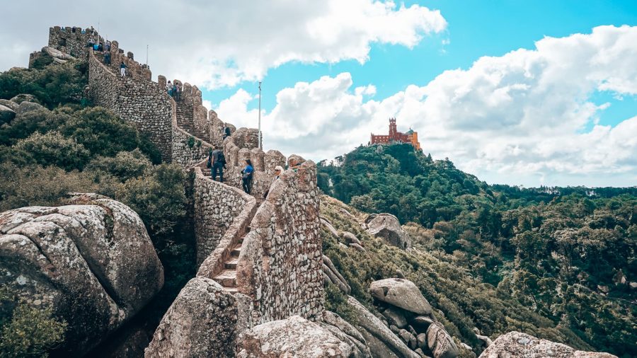 View of Pena Palace from the ancient walls of the Moorish Castle, top things to do in Sintra, Lisbon