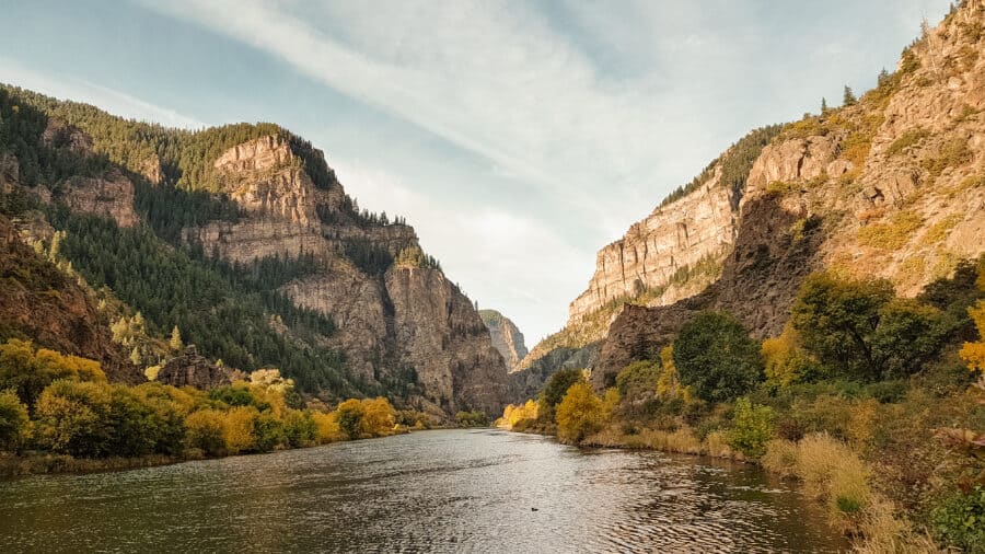 The imposing walls of Glenwood Canyon towering above the Colorado River, Colorado, USA