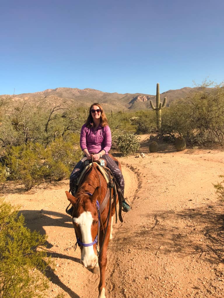 Riding a horse through the Sonora Desert in Tucson, on my Arizona road trip