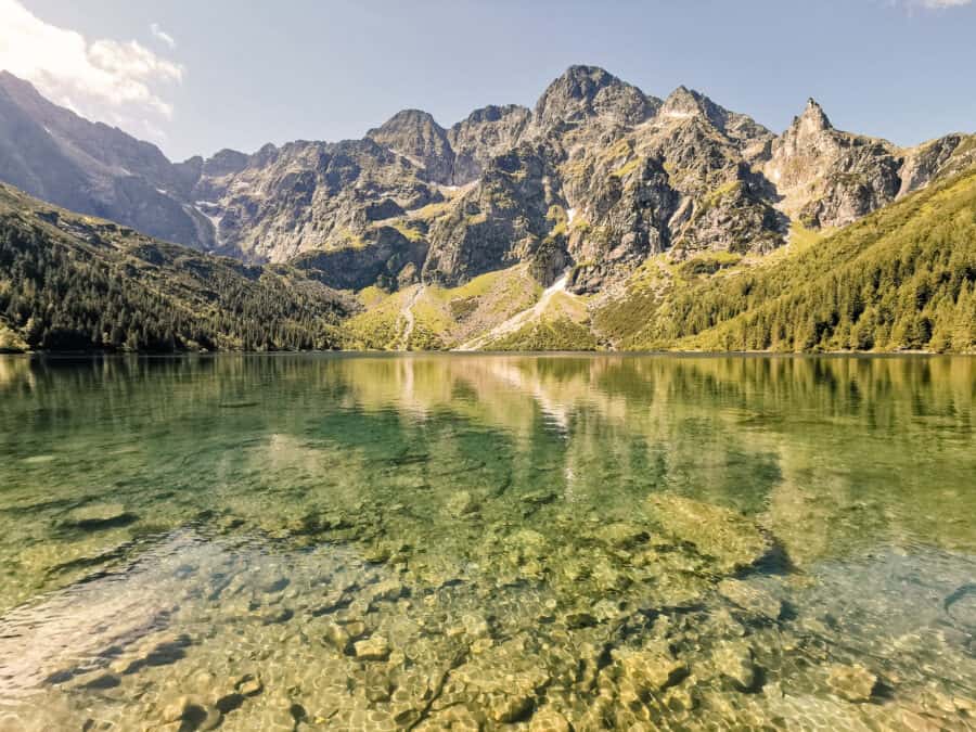 Shimmering Morskie Oko with a dramatic mountain backdrop is one of the best things to do in Krakow, Poland