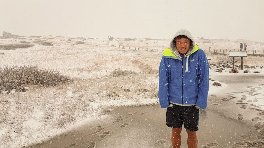 Andy stood in shorts in the snow on the Independence Pass, on our Colorado road trip, Aspen, USA