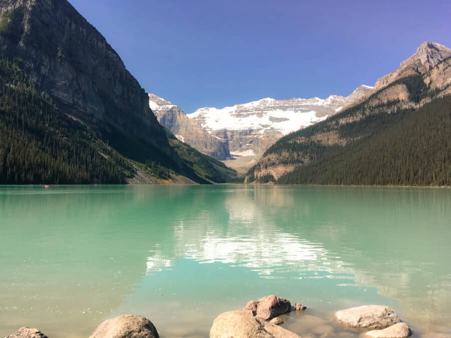 The breathtaking Lake Louise nestled amongst mountains with Victoria Glacier towering in the background, Banff, Canada