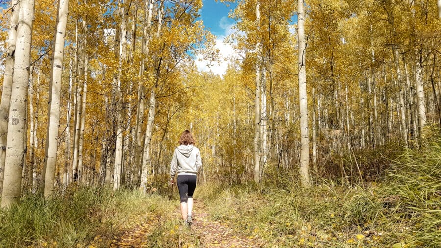 Helen on the walking trails near Maroon Bells with golden fall colours, Aspen on our Colorado road trip, USA