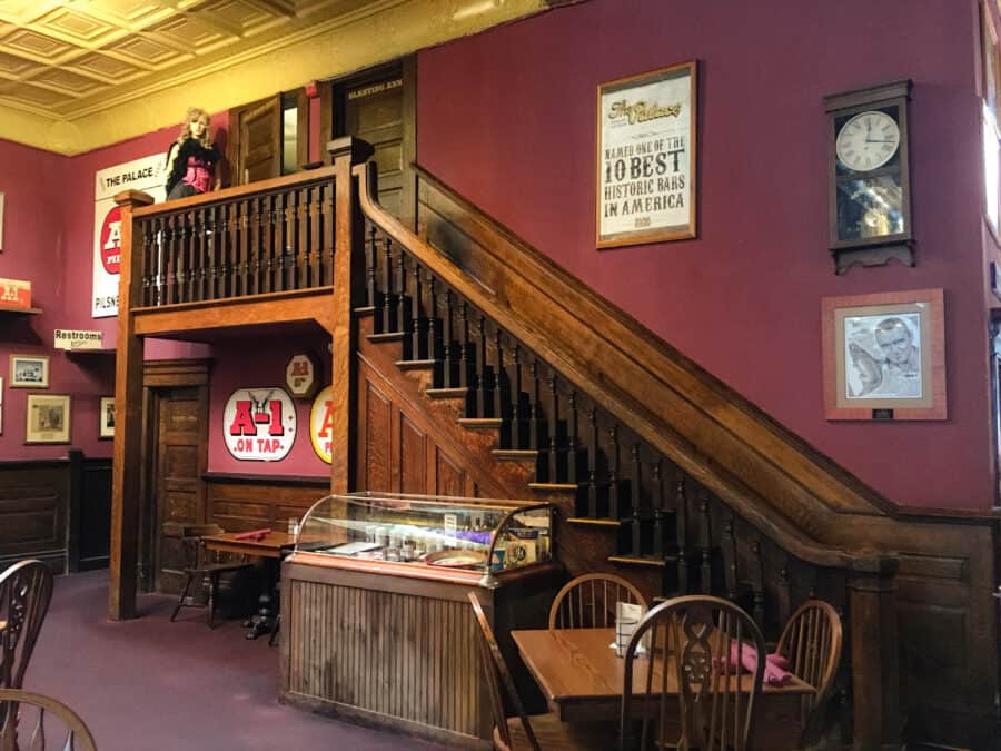 Interior of The Palace Saloon with Big Nose Kate stood at the top of the stairs, Prescott, Arizona