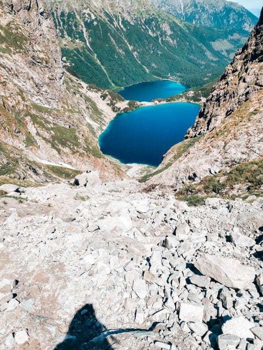 A very steep and rocky path up to Rysy Peak with Czarny Staw and Morskie Oko lakes below, hiking in Zakopane, Poland