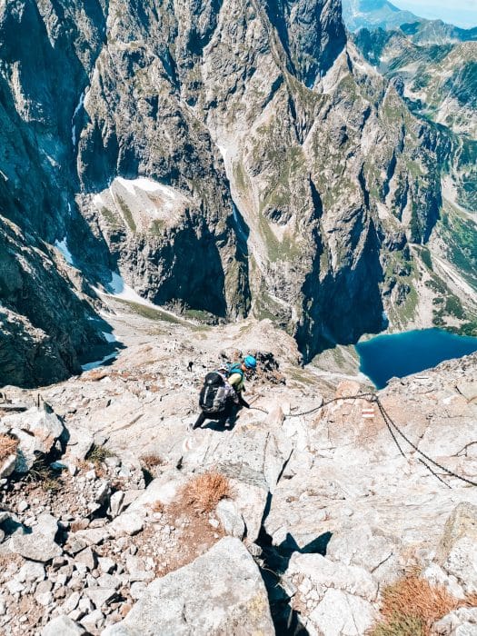 The very steep path up to Rysy Mountain Peak with chains, looking over Czarny Staw Lake below, Zakopane, Poland