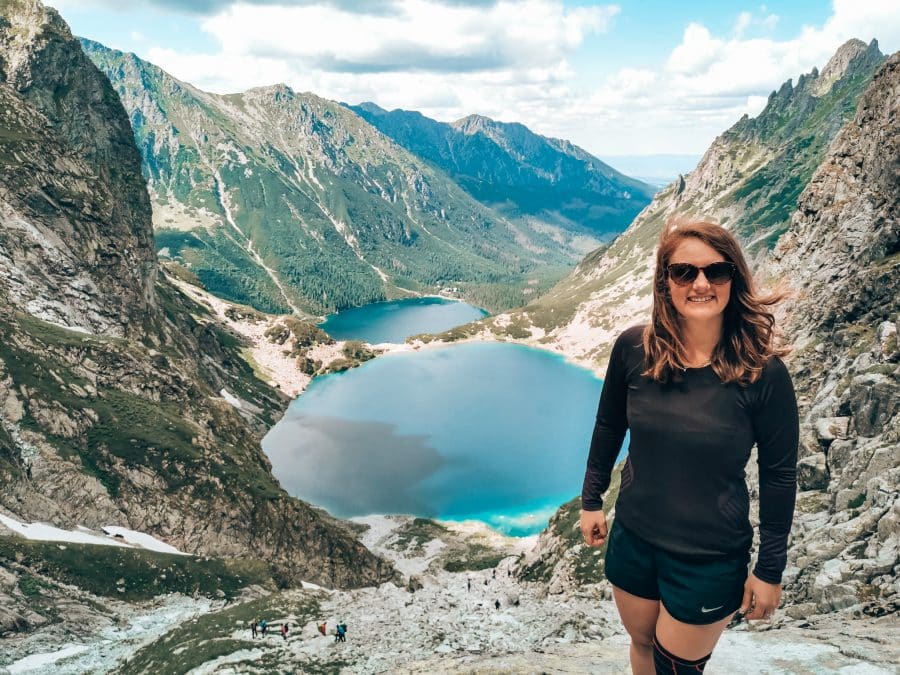 Helen at the incredible viewpoint over the dark blue lakes of Morskie Oko and Czarny Staw up Rysy Mountain