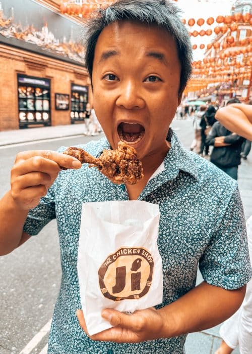 Andy enjoying a yummy chicken lollipop from Ji Chickens, Chinatown Soho, London, England, UK