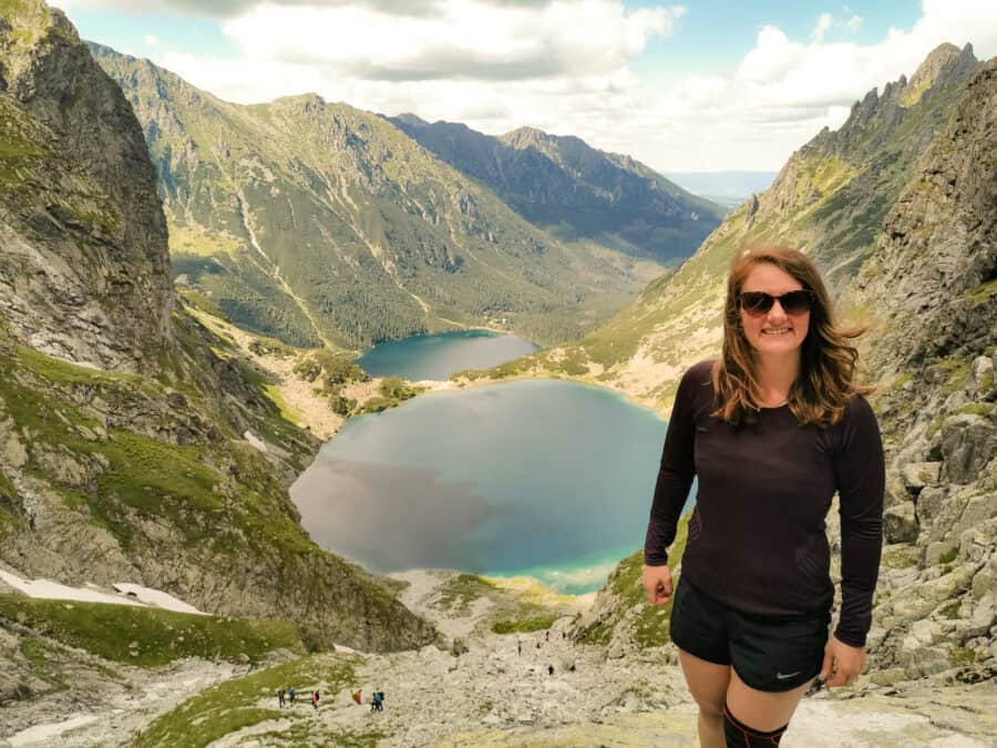 Helen at the incredible viewpoint over the dark blue lakes of Morskie Oko and Czarny Staw up Rysy Mountain, Zakopane, Poland