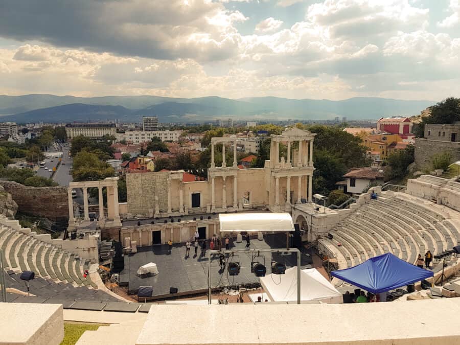 Roman Amphitheatre in Plovdiv with mountains in the distance is a beautiful place to visit in Bulgaria