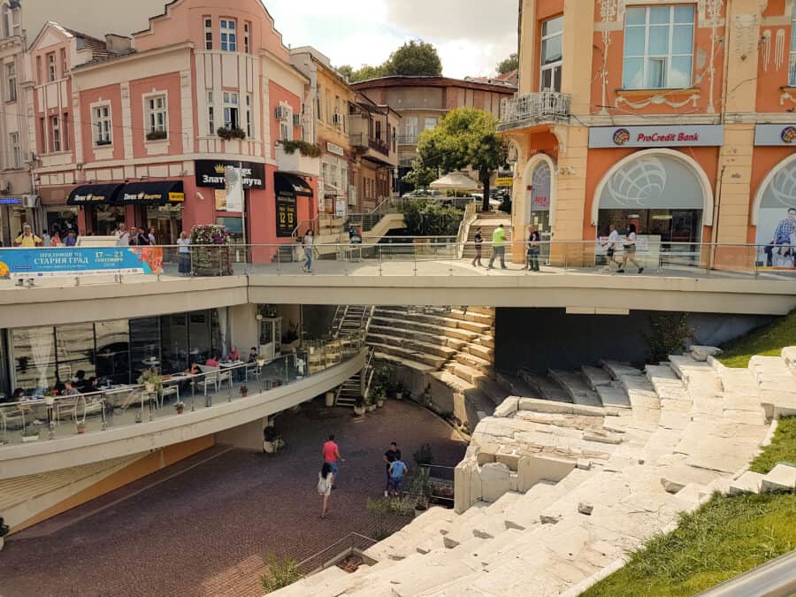 The Roman Stadium in Plovdiv right in the middle of the high street and shops is one of the top places to visit in Bulgaria