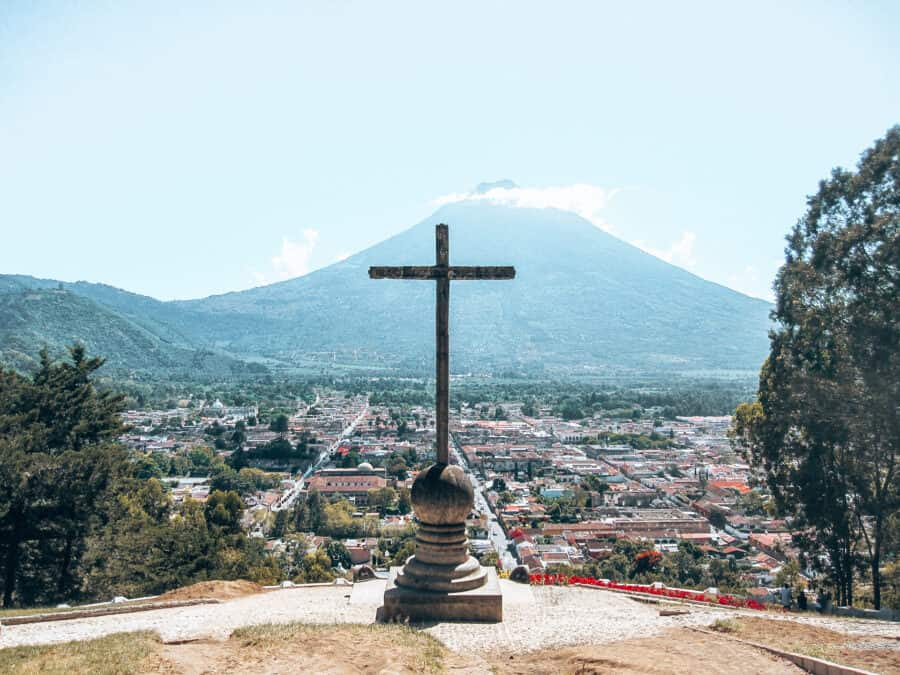 Cerro de la Cruz viewpoint overlooking Antigua with Volcan Agua towering above in the distance, Guatemala