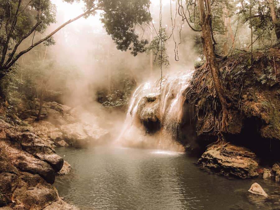 The steamy hot spring waterfall, Finca el Paraiso deep in the dense jungle, Rio Dulce, Guatemala