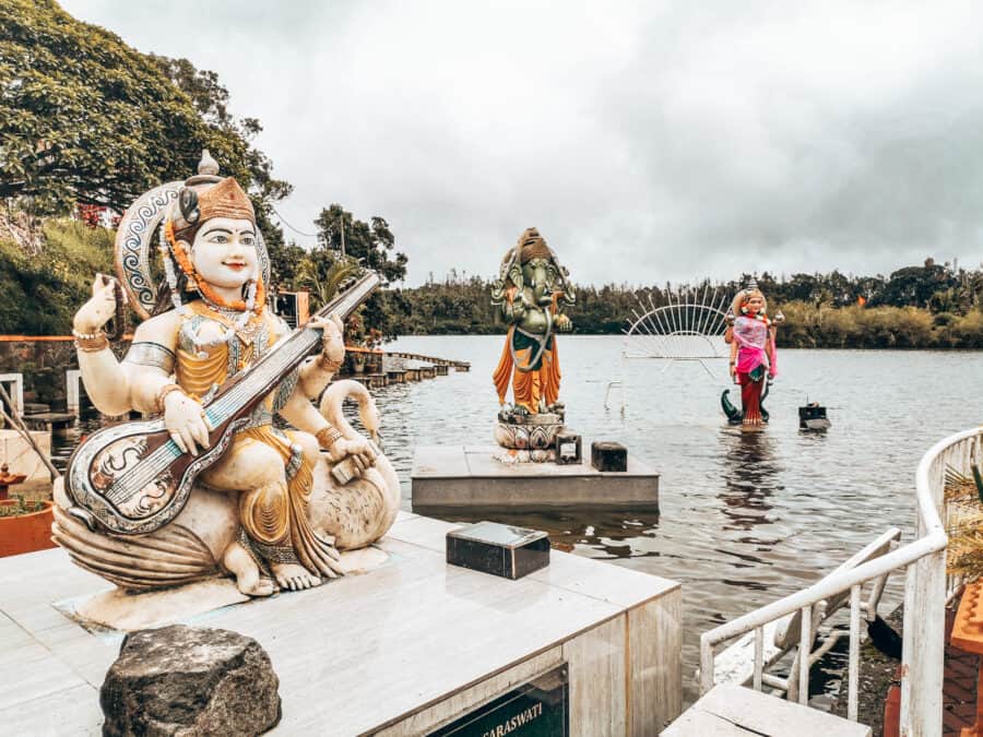 Colourful statues along the lakeshore at Ganga Talao, Mauritius