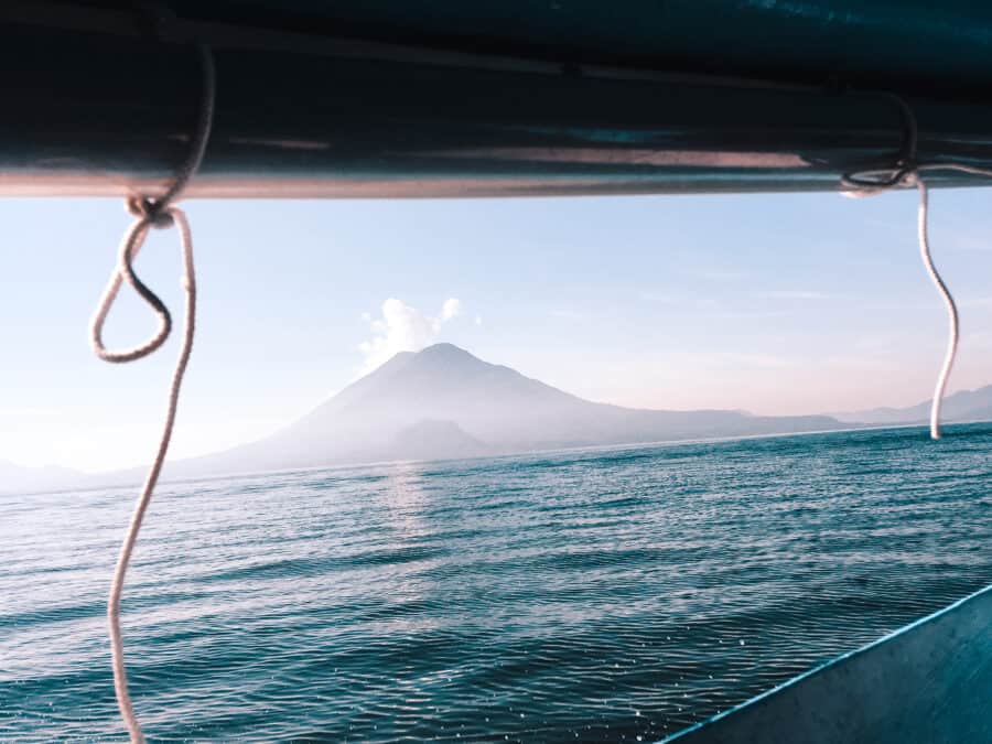 On the boat from Panajachel to San Pedro with a magnificent view of the neighbouring volcanoes on Lake Atitlan, one of the best places to visit in Guatemala