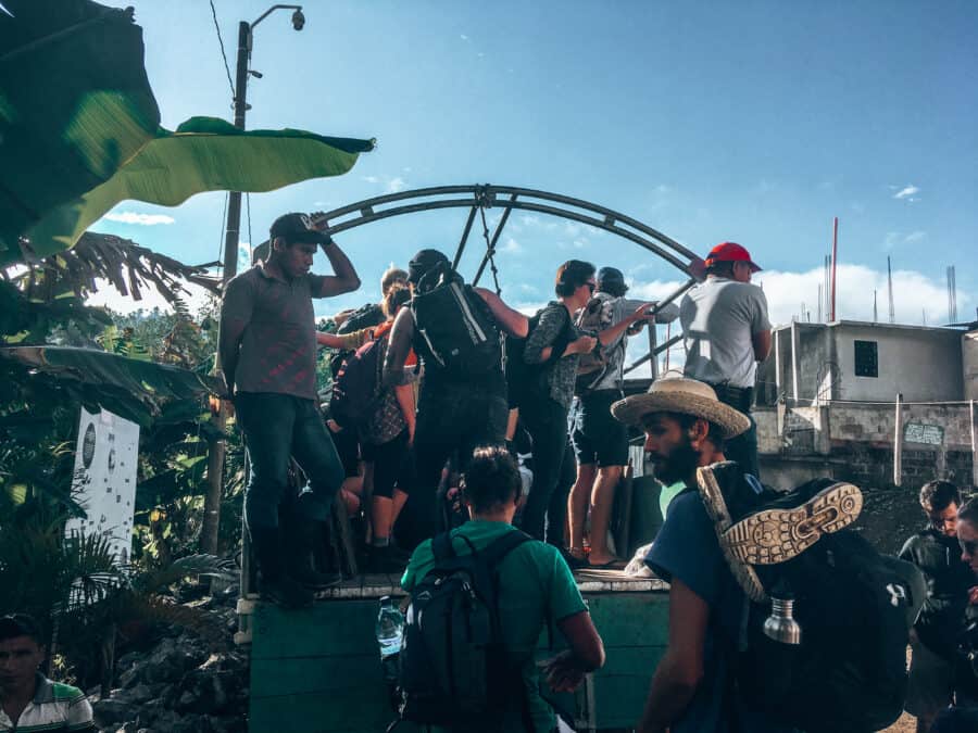 People being crammed into the open backs of trucks to get to their accommodation in Lanquin. Definitely an experience to remember on your Guatemala itinerary