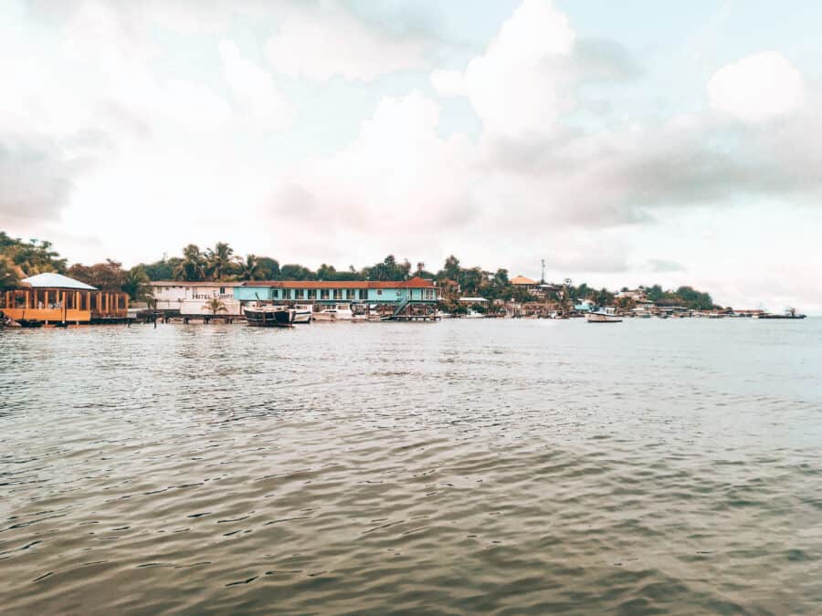 The colourful buildings on the shore of the Caribbean Sea in Livingston, one of the most untouched places to visit in Guatemala