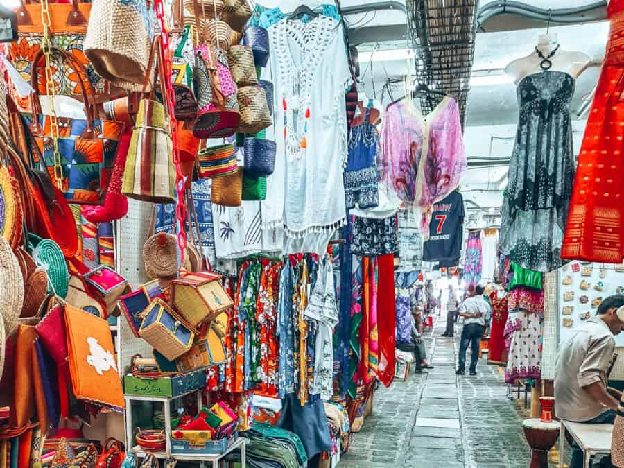 Colourful market stalls selling clothes, bags and accessories in the Central Market, Port Louis, Mauritius