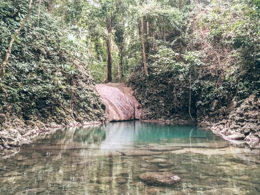 A natural turquoise freshwater pool at Los Siete Altares in Livingston, Guatemala