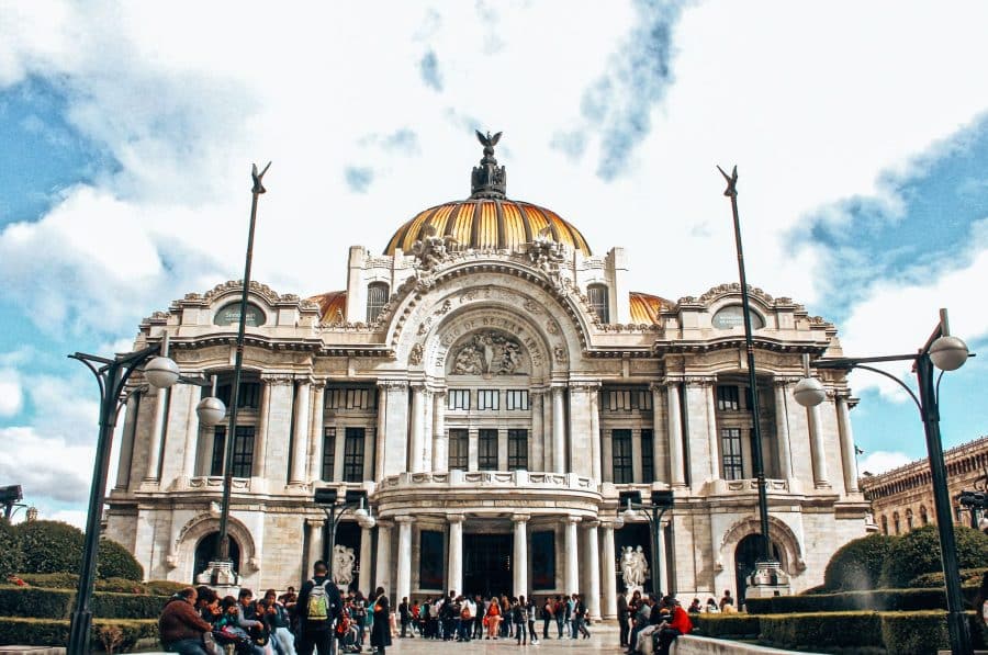 The grand exterior of the Palacio de las Bellas Artes in Mexico City's Historic Centre with opulent gold domes