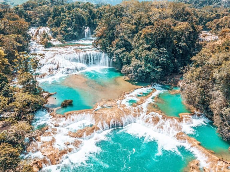 Swimming in the cascading turquoise waters at Agua Azul is one of the best things to do in San Cristobal, Chiapas, Mexico