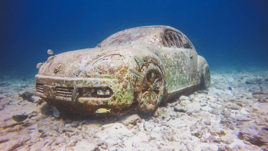 A car on the seafloor at the Cancun Underwater Museum, Mexico