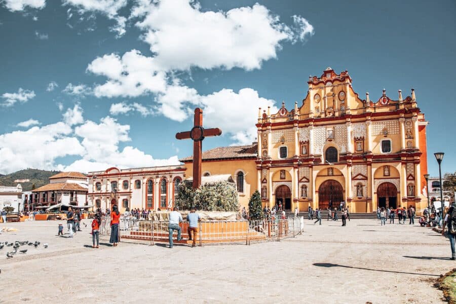 The large bustling Plaza la Paz and bright yellow San Cristobal Cathedral, Mexico