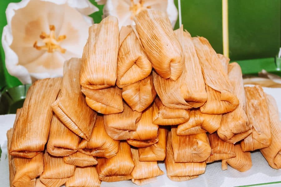 A pile of tamales on a street food stall in Mexico City