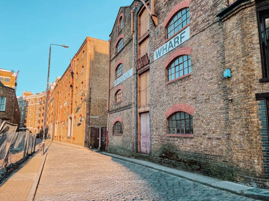 Old converted warehouses line the cobbled streets of Wapping, London