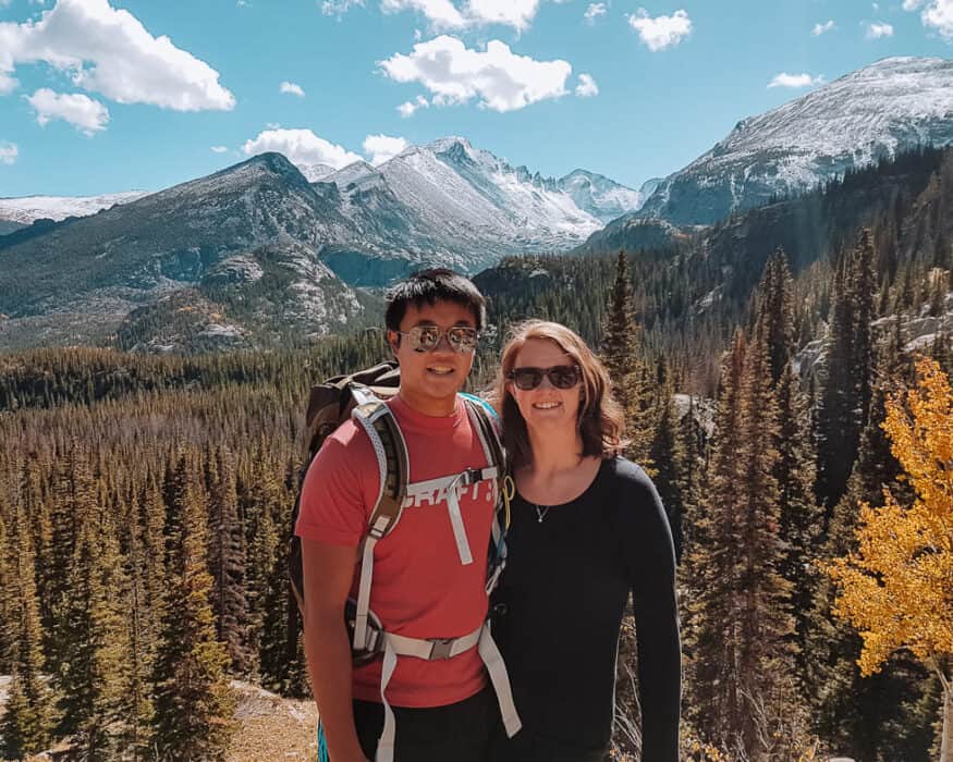 Standing beneath snow-capped peaks on the way up to Emerald Lake, Rocky Mountain National Park, Colorado