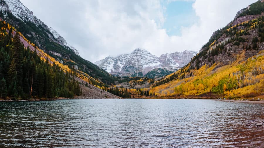 The snow-capped peaks of Maroon Bells towering over Maroon Lake is one of the top places to visit in Colorado, Aspen