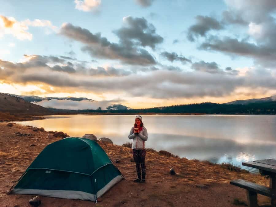 Helen standing next to our tent overlooking the magnificent Twin Lakes, Colorado