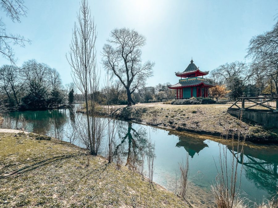 Vibrant Chinese Pagoda sitting on an island in the middle of the peaceful Victoria Park Lake, East London