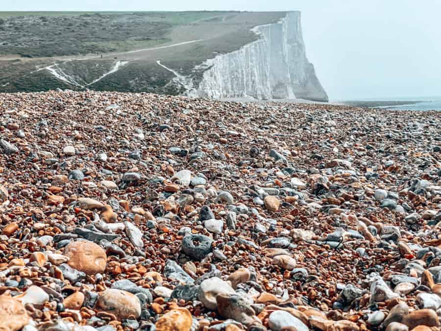 Beautiful shingle Cuckmere Haven Beach with magnificent white chalk cliffs on the Seven Sisters Walk, South Downs National Park, East Sussex