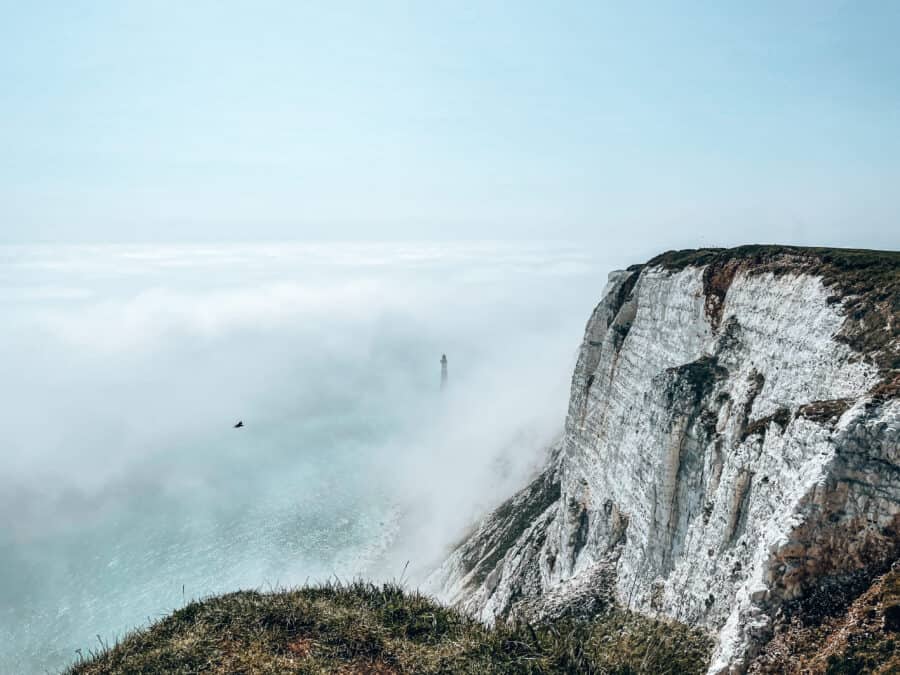 Looking down on to Beachy Head Lighthouse shrouded in mist on our Seven Sisters Walk, East Sussex